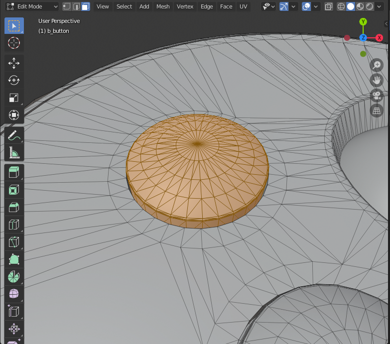 The faces of a button selected for separating from the main mesh